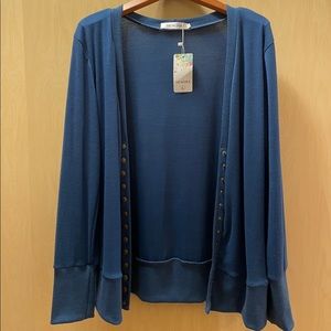 Light navy cardigan with snaps.